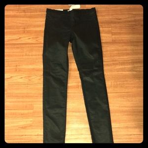 a deep green super stretch skinny pants